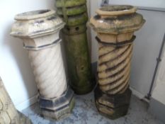 A pair of antique garden chimney pots with swirl-type bodies, 107cms high Condition reports provided