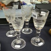A set of four nineteenth century hunting glasses etched with hunting scenes to the funnel shaped