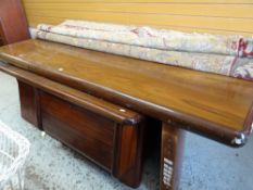 A large mid-century draughtsman's hardwood office corner desk with three hidden drawers, the