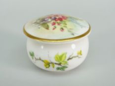 A Royal Worcester porcelain miniature box of circular form with domed lid painted with flowers, date
