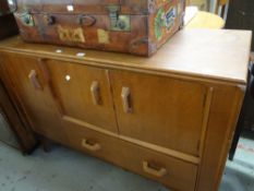 A vintage / mid-century oak sideboard unit having a combination of single drawer and cupboards