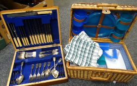 A wicker hamper picnic basket together with a canteen of cutlery Condition reports provided on
