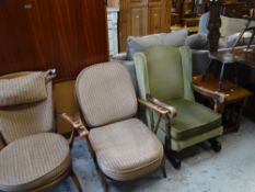 Two mid-century Ercol armchairs, a vintage wingback rocking chair, carved spinning chair & a nest of