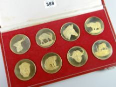 A 1975 cased set of eight gold plated silver medallions issued by The Wildlife Society of South
