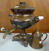 A copper and brass footed samovar with ceramic handles together with a vintage copper and brass