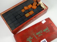 An early to mid-century Mahjong set in a hardwood box with sliding lid Condition reports provided on