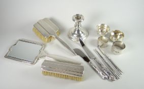 Box of silver items including candlestick, heavy silver napkin ring, silver salt, silver fruit knife