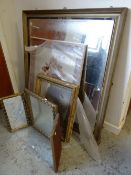 A large antique gilt framed mirror, a smaller gilt framed mirror, a tri-fold mirror and a picture