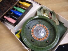 Cased set of six coloured Haz-iards 'billiards' table skittles, together with cased roulette wheel