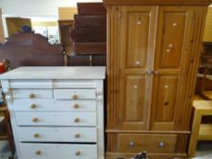 A modern pine double wardrobe with base drawer together with a white painted Victorian chest of four