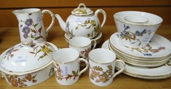 A quantity of Royal Worcester floral tea and tableware decorated with wildflowers in gilding and
