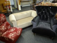 A modern wing back buttoned velvet covered armchair together with a vintage floral red chair and a