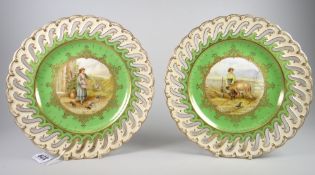 A pair of Coalport cabinet plates painted with farm scenes by Keeling, each of lobed form with