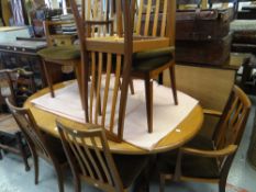 An oval G-Plan extending dining table and 4+2 matching chairs Condition reports provided on