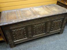 Antique oak blanket chest with heavily carved three-panel front Condition reports provided on