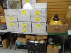 A large quantity of boxed wall lights, ceiling shades ETC (on table and underneath) Condition