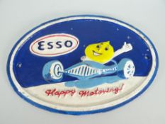 A painted oval cast iron Esso advertising sign 'Happy Motoring', 29cms (BBC Bargain Hunt)