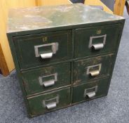 A vintage painted metal six-drawer filing chest with mounted white metal index holders and gilded