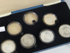 A collection of Royal Mint commemorative coins for Her Majesty Queen Elizabeth the Queen Mother