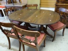 A twin-pedestal mahogany dining table and four antique mahogany chairs (distressed) Condition