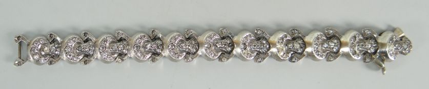 A vintage silver bracelet with hinging links set with pseudo-diamonds (BBC Bargain Hunt) Condition