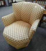 A vintage geometric patterned upholstery horseshoe shaped armchair Condition reports provided on