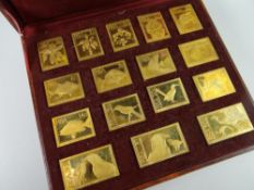 A wooden cased set of sixteen 1974-1975 Africana commemorative mint replica edition stamps with