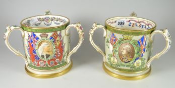 A pair of antique Copeland pottery commemorative loving cups with three handles commemorating the