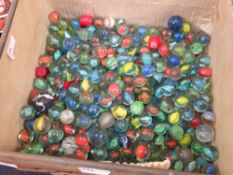 A vintage Huntley & Palmers biscuit tin containing a large quantity of vintage marbles Condition