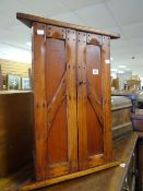 A modern rustic hardwood two-door corner cupboard, 69cms high Condition reports provided on