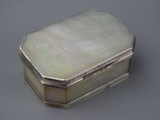 A FLORAL DECORATED MOTHER OF PEARL OBLONG MINIATURE BOX with canted corners and believed silver