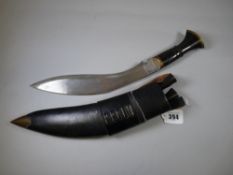 A HORN HANDLED VINTAGE KHUKRI KNIFE, leather sheathed with Karda & Chakmak intact, 38.5 cms long