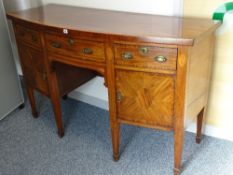 A SHERATON MAHOGANY INLAID BOW FRONT SIDEBOARD with boxwood strung and crossbanded top over three