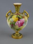 A ROYAL WORCESTER TWO HANDLED PEDESTAL VASE, hand painted by Jenny Lander, shape no. 2449 with