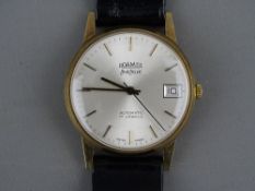 A NINE CARAT GOLD CASED GENT'S ROAMER LIMELIGHT AUTOMATIC WRISTWATCH with date aperture on a leather