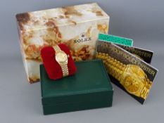 AN EIGHTEEN CARAT GOLD LADY'S ROLEX OYSTER PERPETUAL DATEJUST CIRCULAR DIAL WRISTWATCH with Rolex