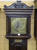 AN EARLY 20th CENTURY OAK ENCASED LONGCASE CLOCK with square brass dial and pendulum movement