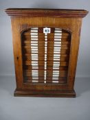 A THOMAS GURNEY MAHOGANY COLLECTOR'S CABINET of twenty six drawers with glazed front door, all