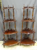 A GOOD PAIR OF REPRODUCTION MAHOGANY FOUR SHELF CORNER WHATNOTS, the shelves having carved rail