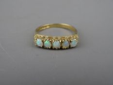 A NINE CARAT GOLD FIVE STONE OPAL DRESS RING, 2.2 grms gross, size 'O/P'