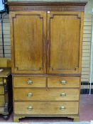A MID 19th CENTURY MAHOGANY TWO PIECE PRESS CUPBOARD having a dentil cornice over two cupboards
