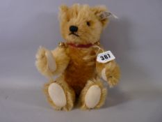 A STEIFF 'BUTTON IN EAR' TEDDY BEAR, 1993 blonde mohair limited edition (00344/1500), wearing a
