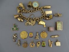 A NINE CARAT GOLD CHARM BRACELET WITH PADLOCK CLASP holding twelve charms along with a further