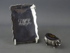 A PLAIN SILVER CARD CASE with monogram, 2 troy ozs, Birmingham 1911 and a silver pig pin cushion,