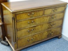 A CIRCA 1830 MAHOGANY CHEST of two short over three long drawers, oak lined with circular pommels