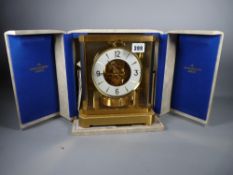 A CASED & BOXED JAEGER LE COULTRE ATMOS VIII CLOCK, no. 255337, brass encased with glass panels