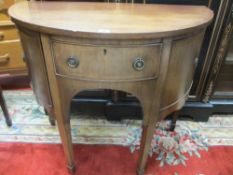 AN EDWARDIAN MAHOGANY & LINE INLAID COMPACT DRUM CABINET having a centre drawer with two cupboards
