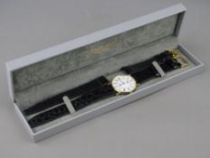 A GENT'S NINE CARAT GOLD CIRCULAR DIAL LONGINES PRESENCE WRISTWATCH with Roman numerals and black