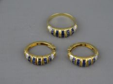 A FOURTEEN CARAT GOLD SAPPHIRE & CZ DRESS RING, the sapphires set in five triples, size 'N/O', 3.3