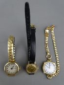 THREE NINE CARAT GOLD CASED LADY'S WRISTWATCHES including a small Tissot Stylist on a leather strap